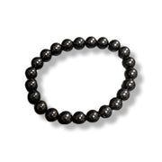 Black beaded bracelet on a white background