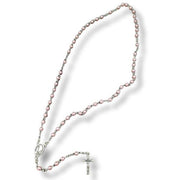 Pink pearl beaded rosary with a cross on a white background