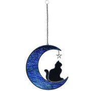 Decorative hanging moon with a cat silhouette and star on a white background