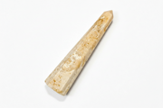 A natural agate obelisk with a warm beige and light brown coloration, displayed diagonally on a clean white background.