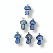 Set of blue mushroom-shaped ornaments on a white background