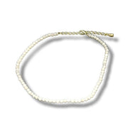 Moonstone anklet  with gold clasp on a white background