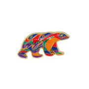 Colorful bear-shaped pin on a white background