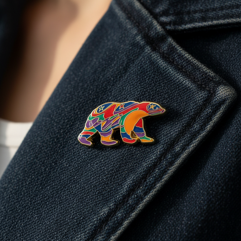 Colorful bear pin on a dark blue coat