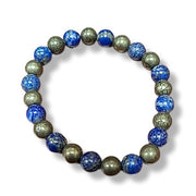 Bracelet with blue and green beads on a white background