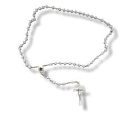 Rosary with blue stone beads and a silver cross on a white background