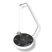 Black and white pendulum with astrological design on a white background