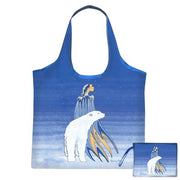 Blue tote bag with polar bear design on a white background