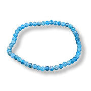 Blue beaded bracelet on a white background