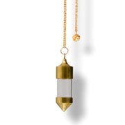 Gold pendulum  with clear glass element on a white background