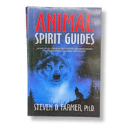 Book titled 'Animal Spirit Guides' with a wolf illustration on the cover