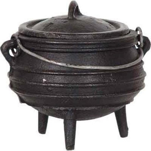 Black cast iron cauldron with lid on a white background