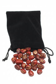 Black drawstring bag with red jasper runes on a white background