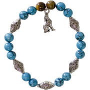 Bracelet with blue beads and silver charms on a white background