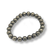 Beaded bracelet with textured beads on a white background