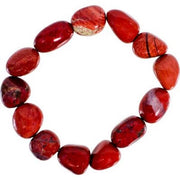 Red beaded bracelet on a white background