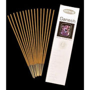 Incense sticks with their packaging labeled 'Ganesh' on a black background