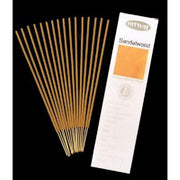 Sandalwood incense sticks with packaging on a black background