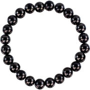 Black beaded bracelet on a white background