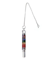 Pendulum Chakra with Quartz Crystal Point on a white background