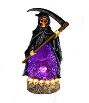 Statue of a Grim Reaper with a glowing purple crystal ball on a white background