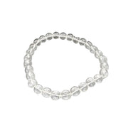 Clear beaded bracelet on a black background
