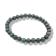 Round beaded bracelet with a pattern on a white background