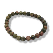 Round beaded bracelet with multicolor stones on a white background