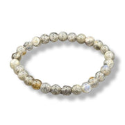 Beaded bracelet with textured beads on a white background