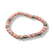 Beaded bracelet with pink and brown beads on a white background